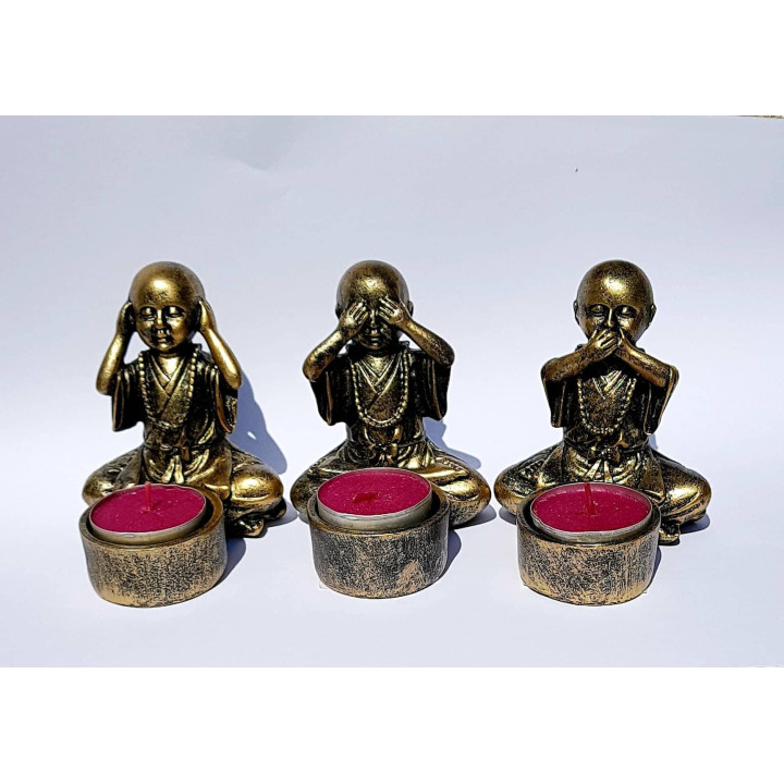 {
  "text": "Candle holder - Wise Buddhas"
}
